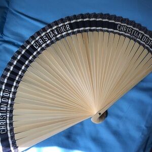 Dior gift holding fan